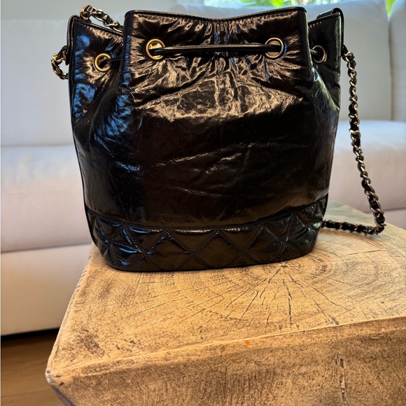 CHANEL Black Quilted Lambskin Drawstring Shoulder Bag with Gold Hardware